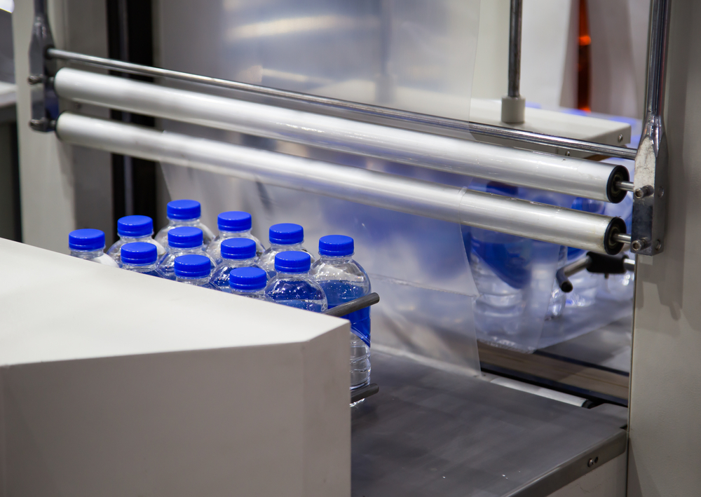 Shrink wrapping machine in operation